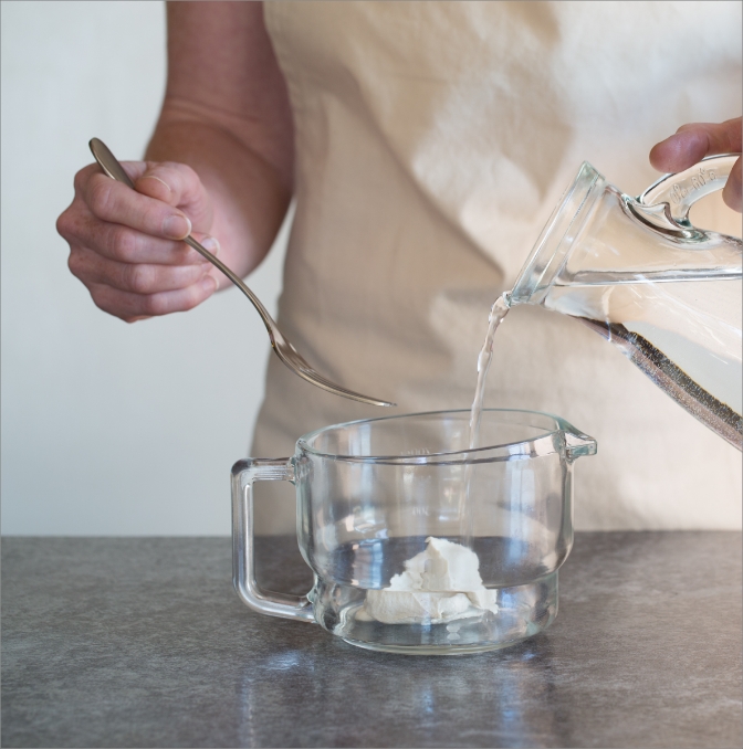 photo of water being poured into a jug